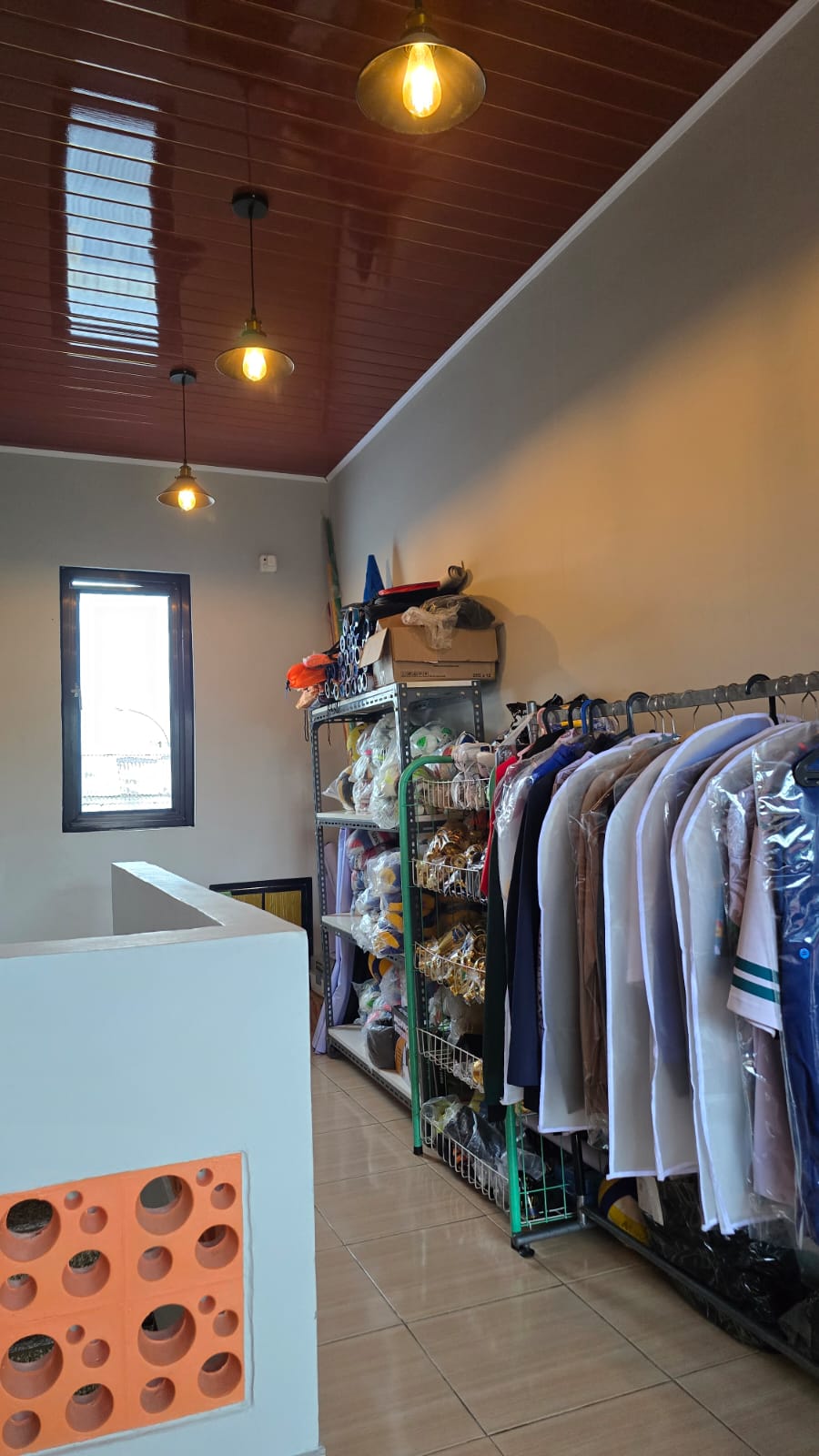 High-rise city office building with glass windows and modern design architecture, standing tall under a clear blue sky with soft daylight